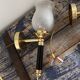 Pair of brass and black torchiere wall lights