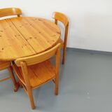 Suite of a round table with extension and 4 vintage pine chairs from the 60s and 70s