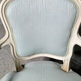 Pair of Louis XV style armchairs in patinated wood, light blue fabric.