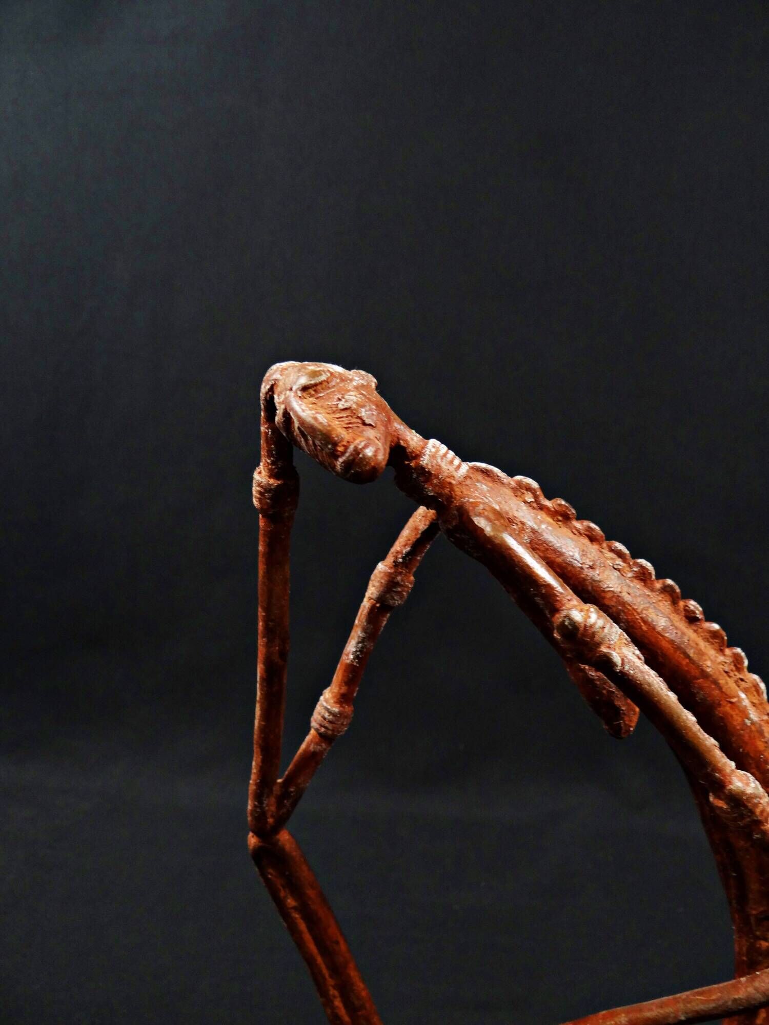 Dogon Nommo bronze statue with brown patina and red highlights, mid-20th century