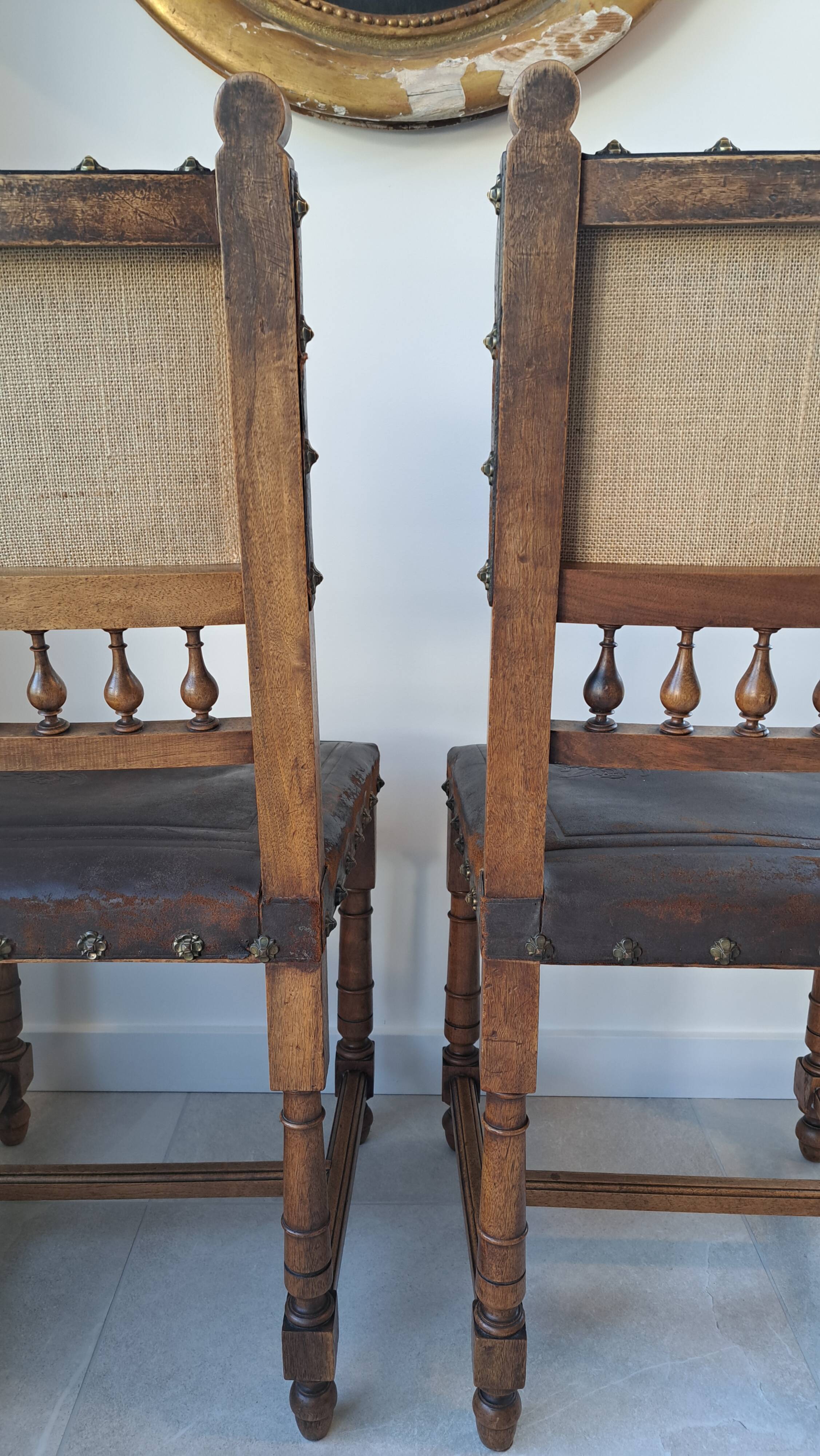 Pair of antique chairs in embossed leather, Henri II style.