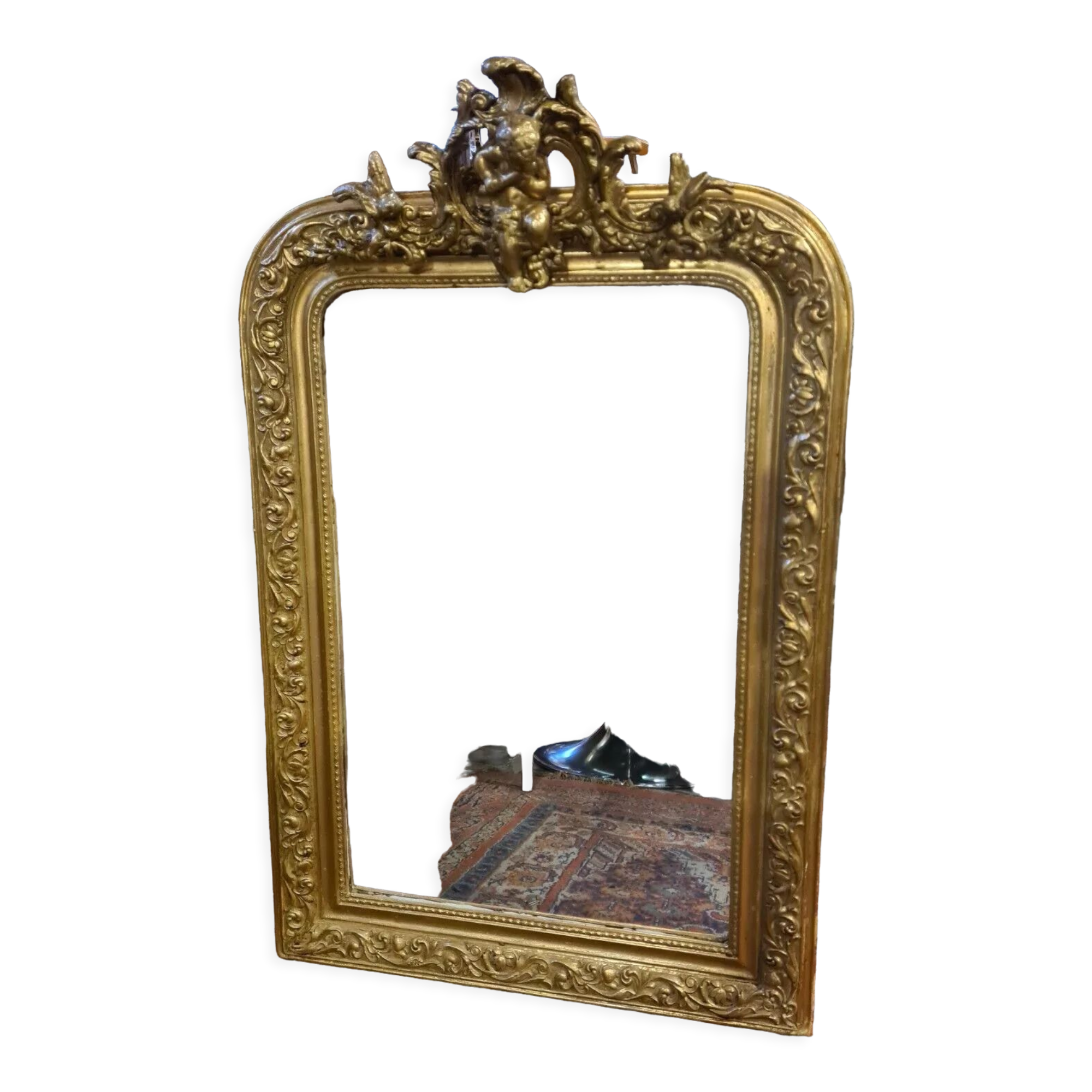 Golden mirror with a flute-playing angel