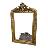 Golden mirror with a flute-playing angel