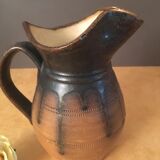 Antique ceramic pitcher with drips and striated patterns gradients of chestnuts