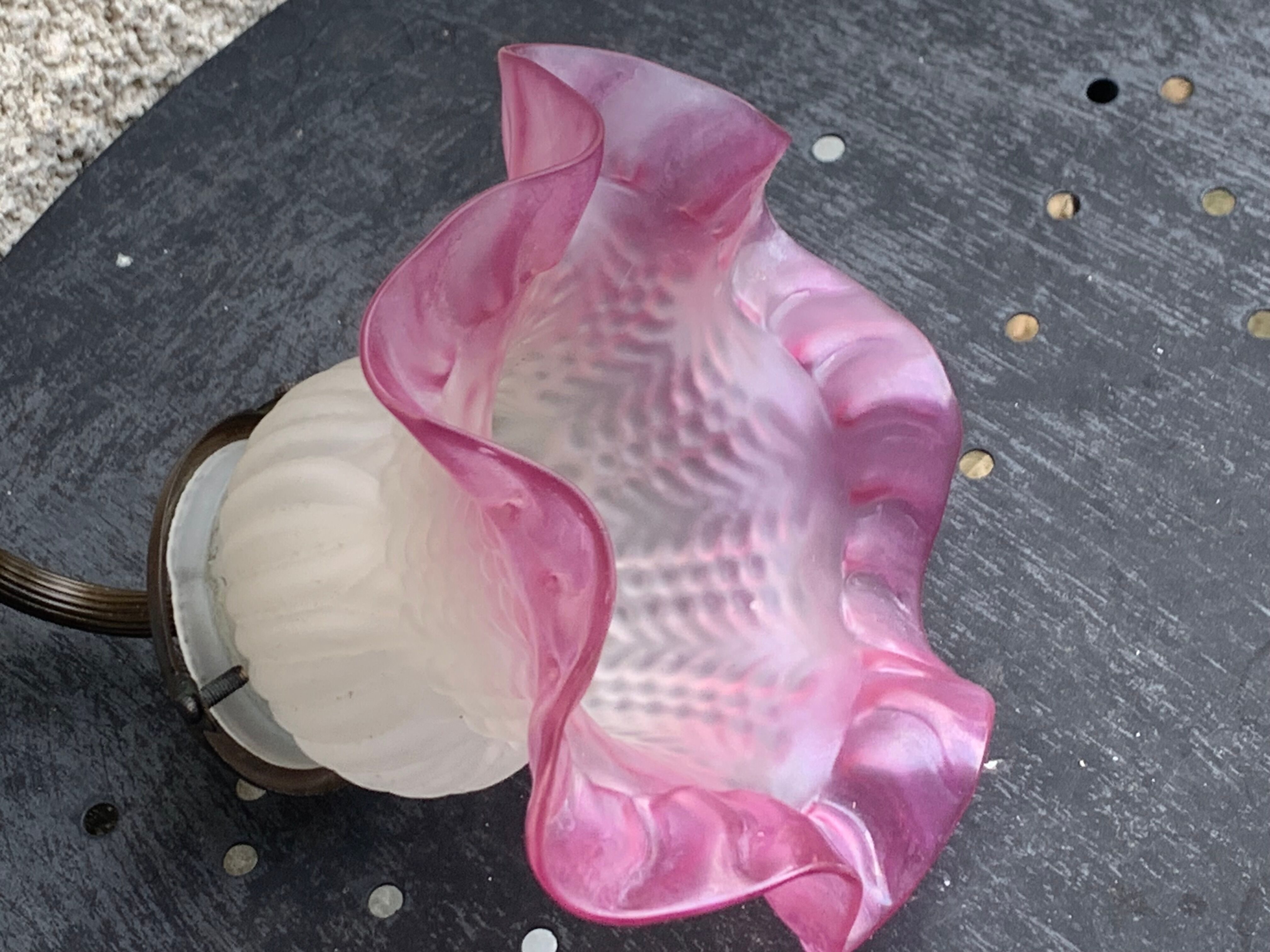 Metal wall lamp with frosted glass shade in the shape of a pink corolla