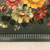 Painted metal tray decorated with flowers on a green background