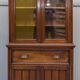 Light wood library with a secretary and leather surface.