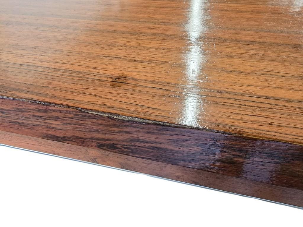 Vintage wooden dining table with chrome frame.