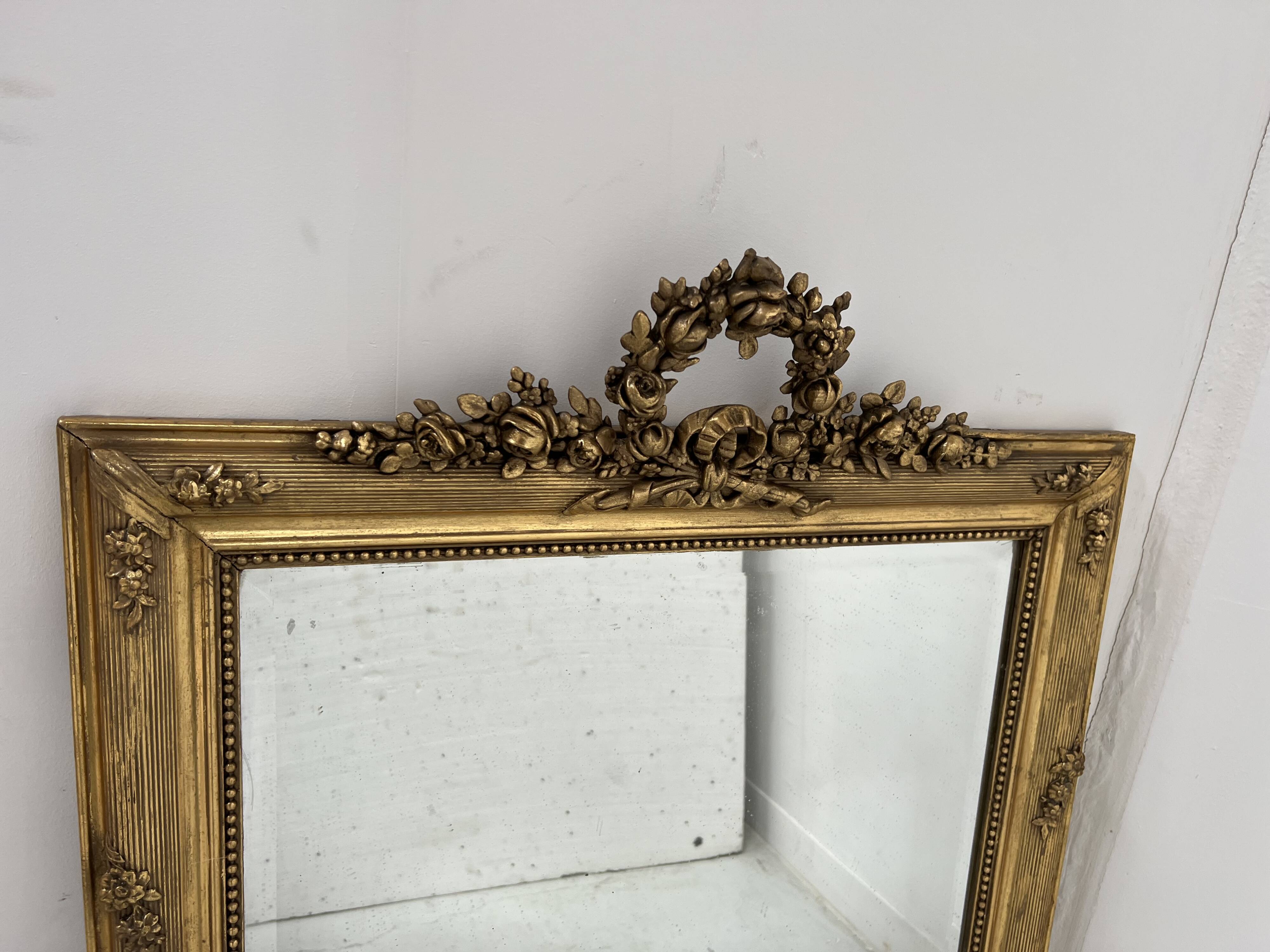 Louis XVI style mirror in wood and gilded stucco, 19th century