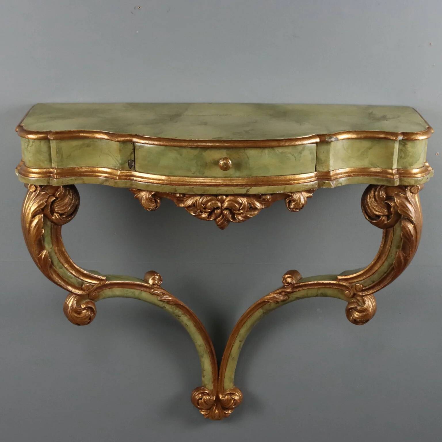 19th-century carved wooden drop-leaf console.