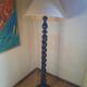 Sculptural floor lamp made of twisted turned wood.