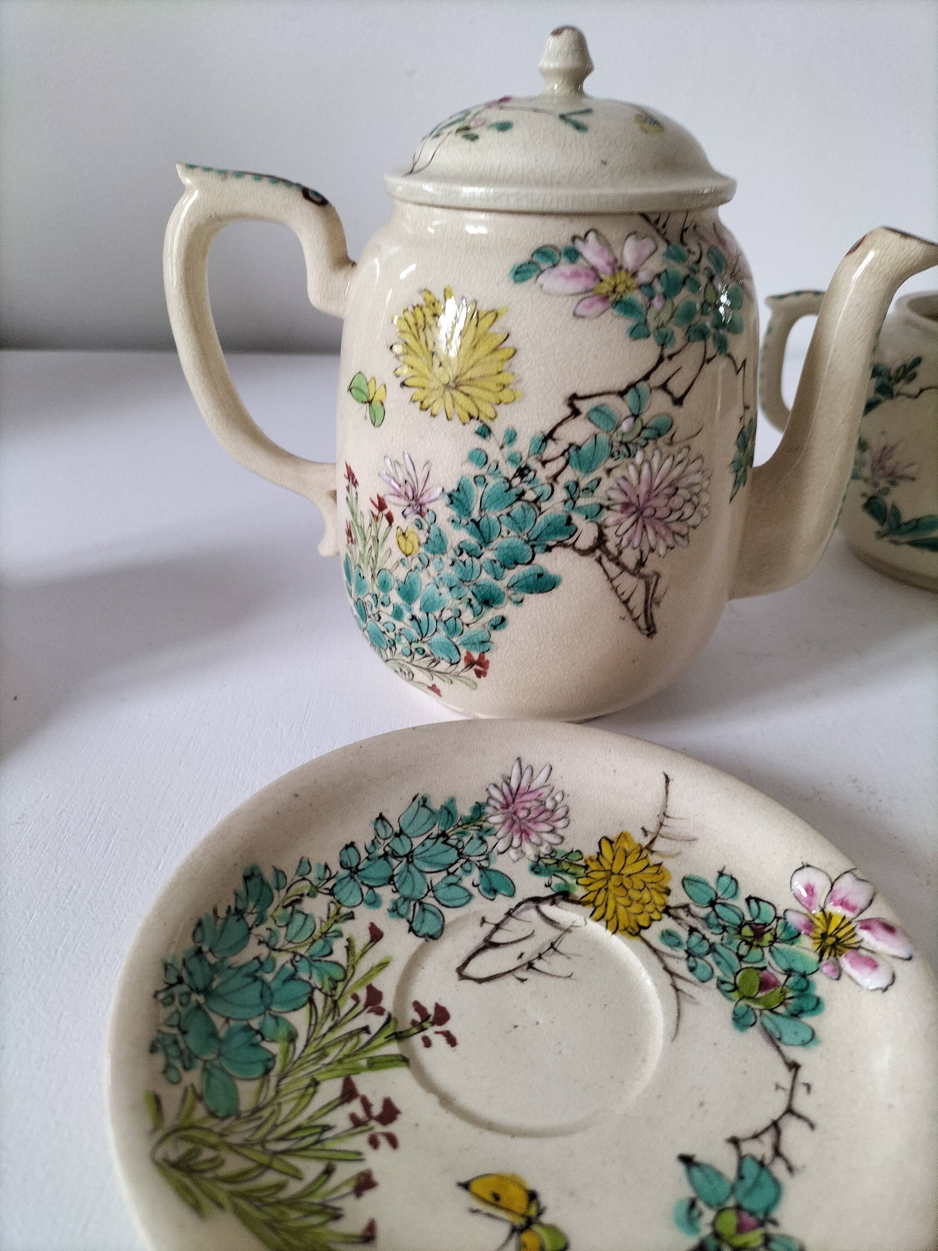 Japanese-style tea set in cracked earthenware with chrysanthemum flowers