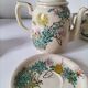 Japanese-style tea set in cracked earthenware with chrysanthemum flowers