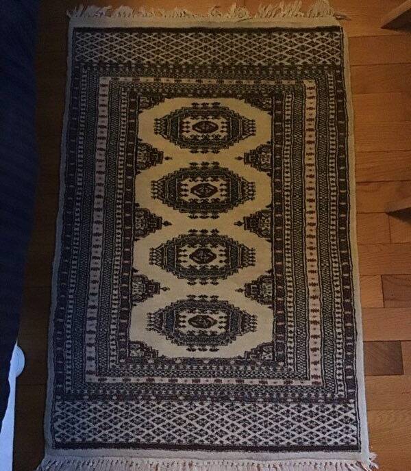 Vintage rug with oriental and geometric patterns, fringes, 63 × 90 cm