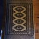 Vintage rug with oriental and geometric patterns, fringes, 63 × 90 cm