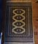 Vintage rug with oriental and geometric patterns, fringes, 63 × 90 cm