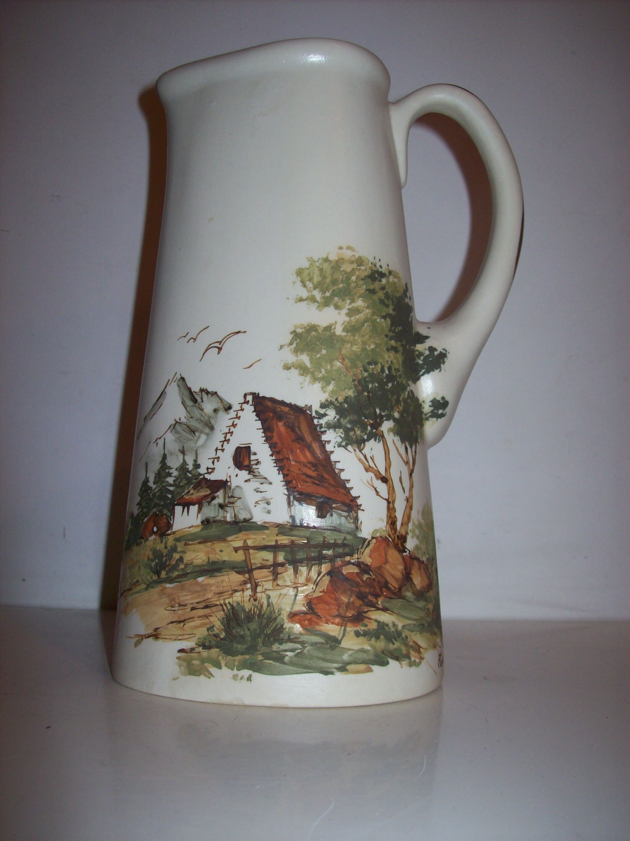 Ceramic pitcher with hand-painted decoration