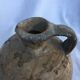 Ancient jug in glazed sandstone