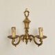 Set of four two-light wall sconces in gilded brass — Louis XVI style