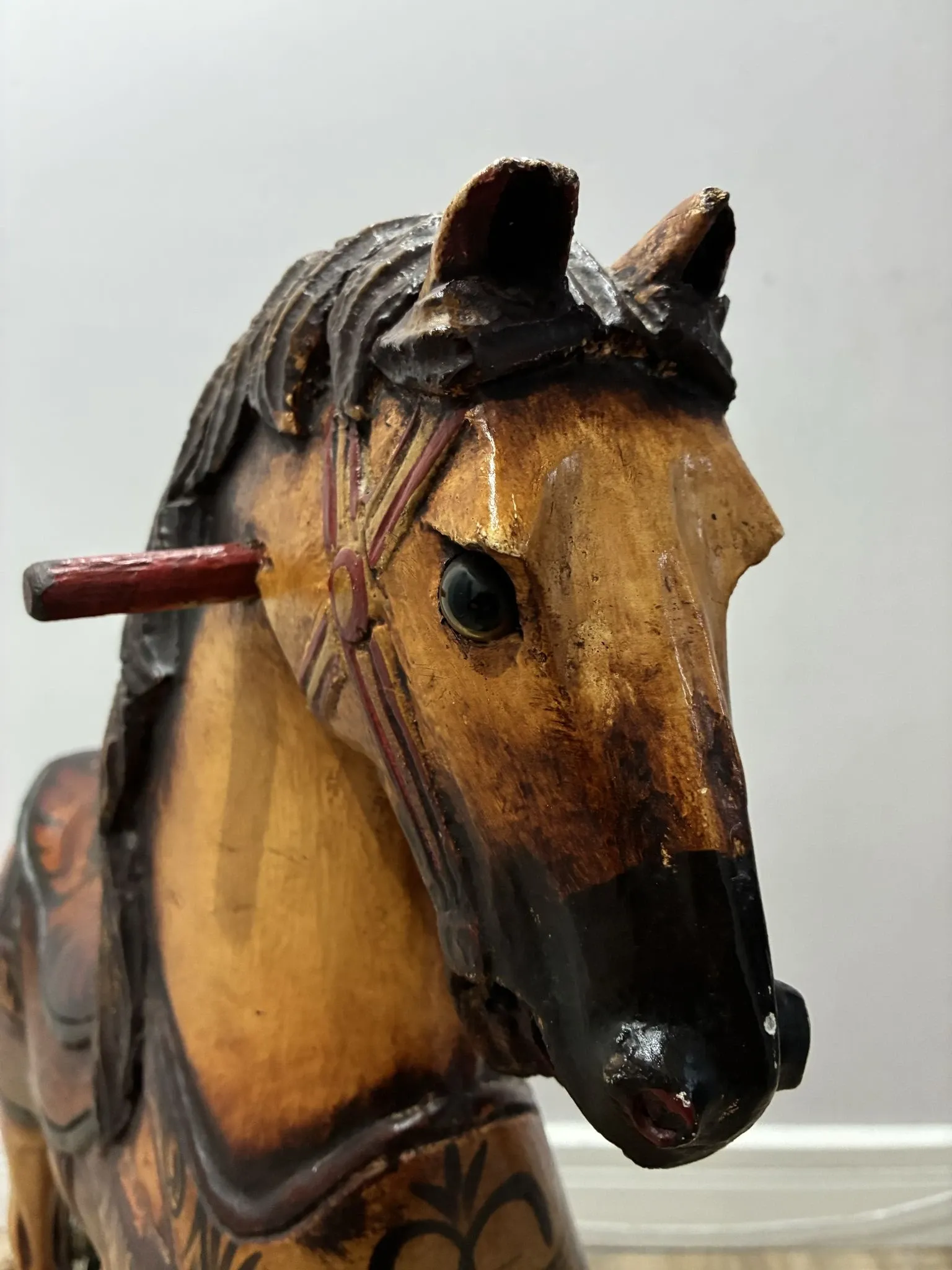 Antique hand-carved rocking horse on wheels, early 20th century