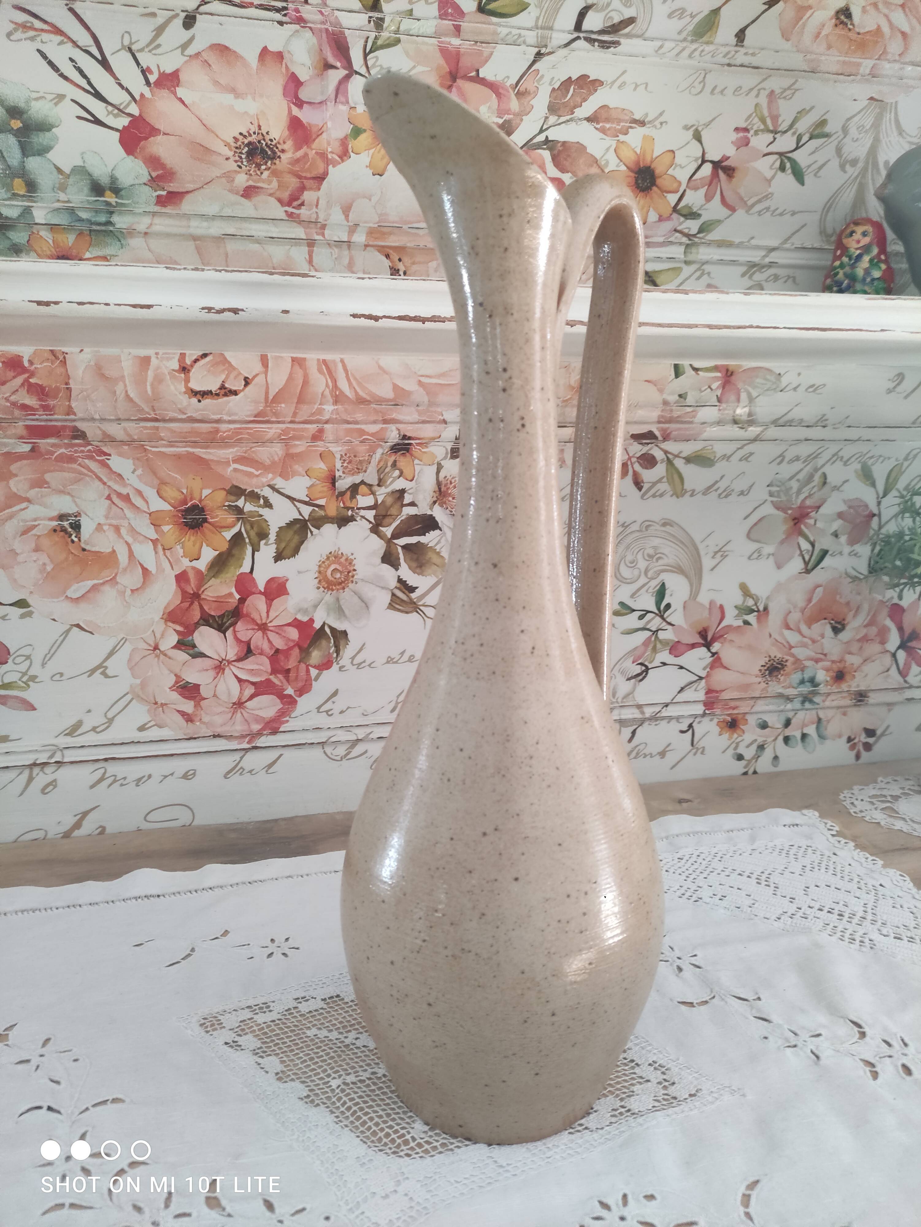 Vintage pitcher in light brown sandstone speckled