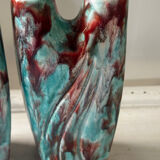 Vintage pair of turquoise and red ceramic candlesticks