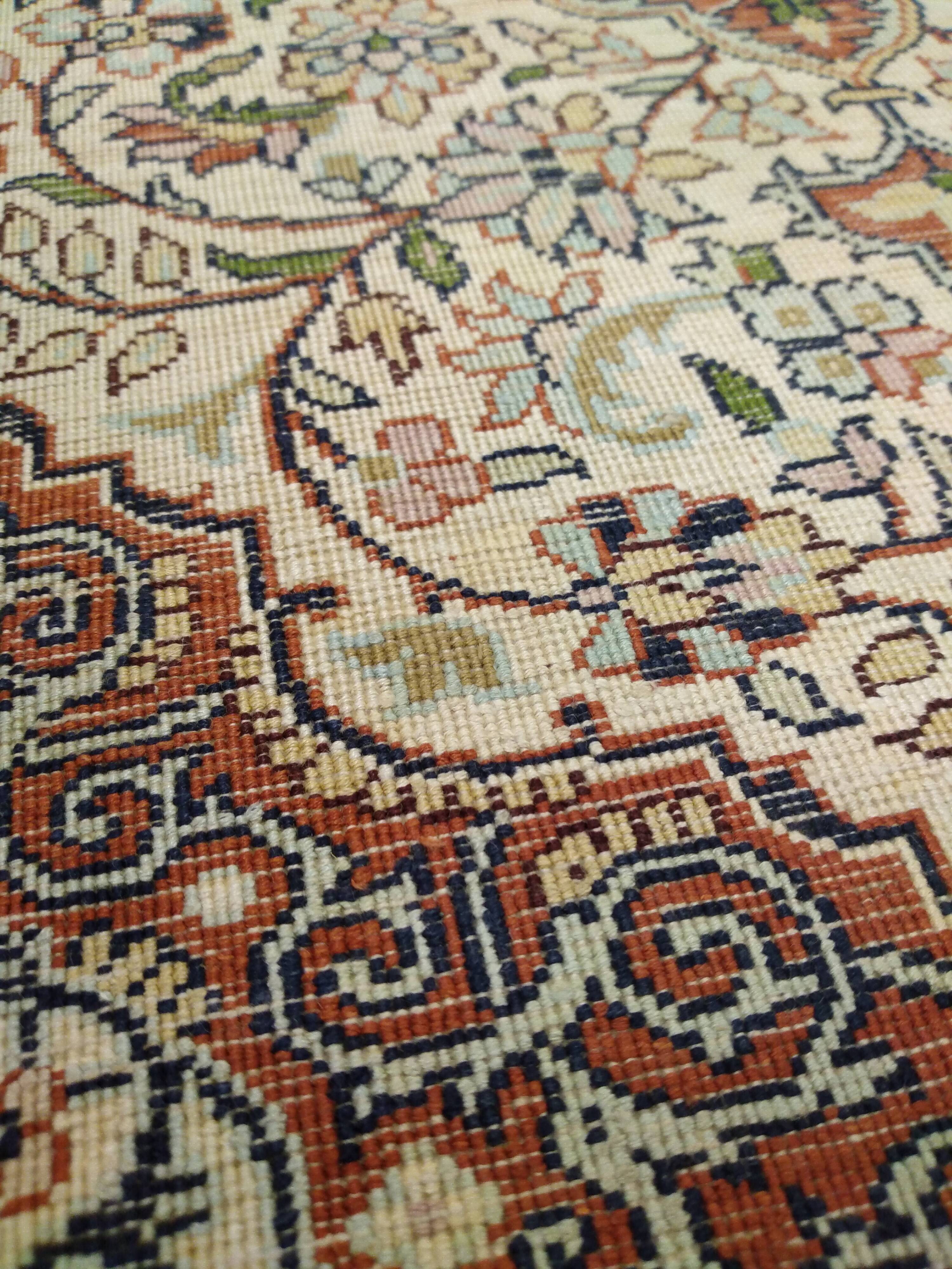 Handmade Persian wool and silk rug