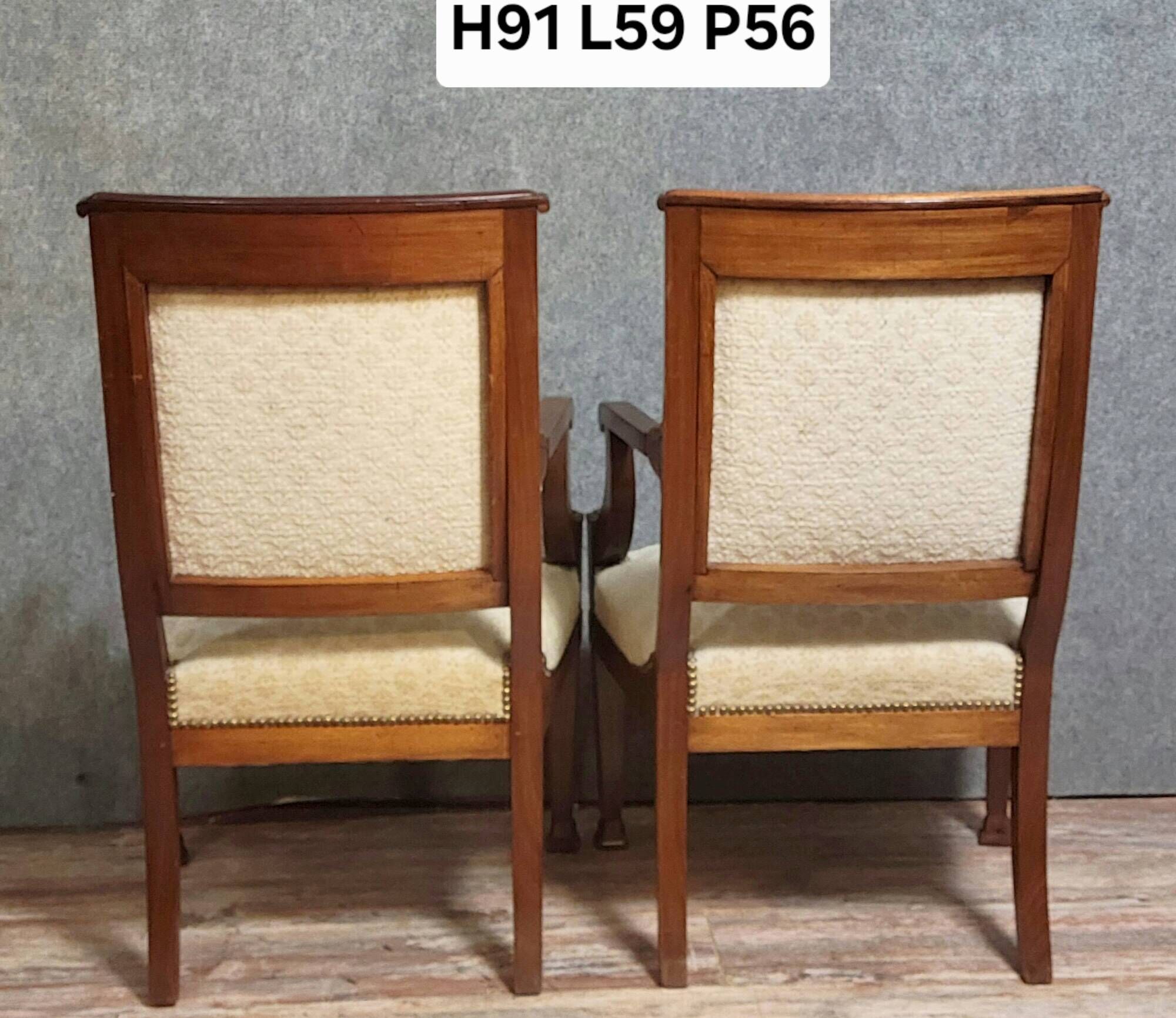 Pair of Empire period armchairs, in mahogany and gilded bronze.
