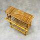 1960s rattan and bamboo coffee table, with its magazine rack.