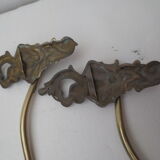 Pair of embraces in numerotée solid brass, rocaille style