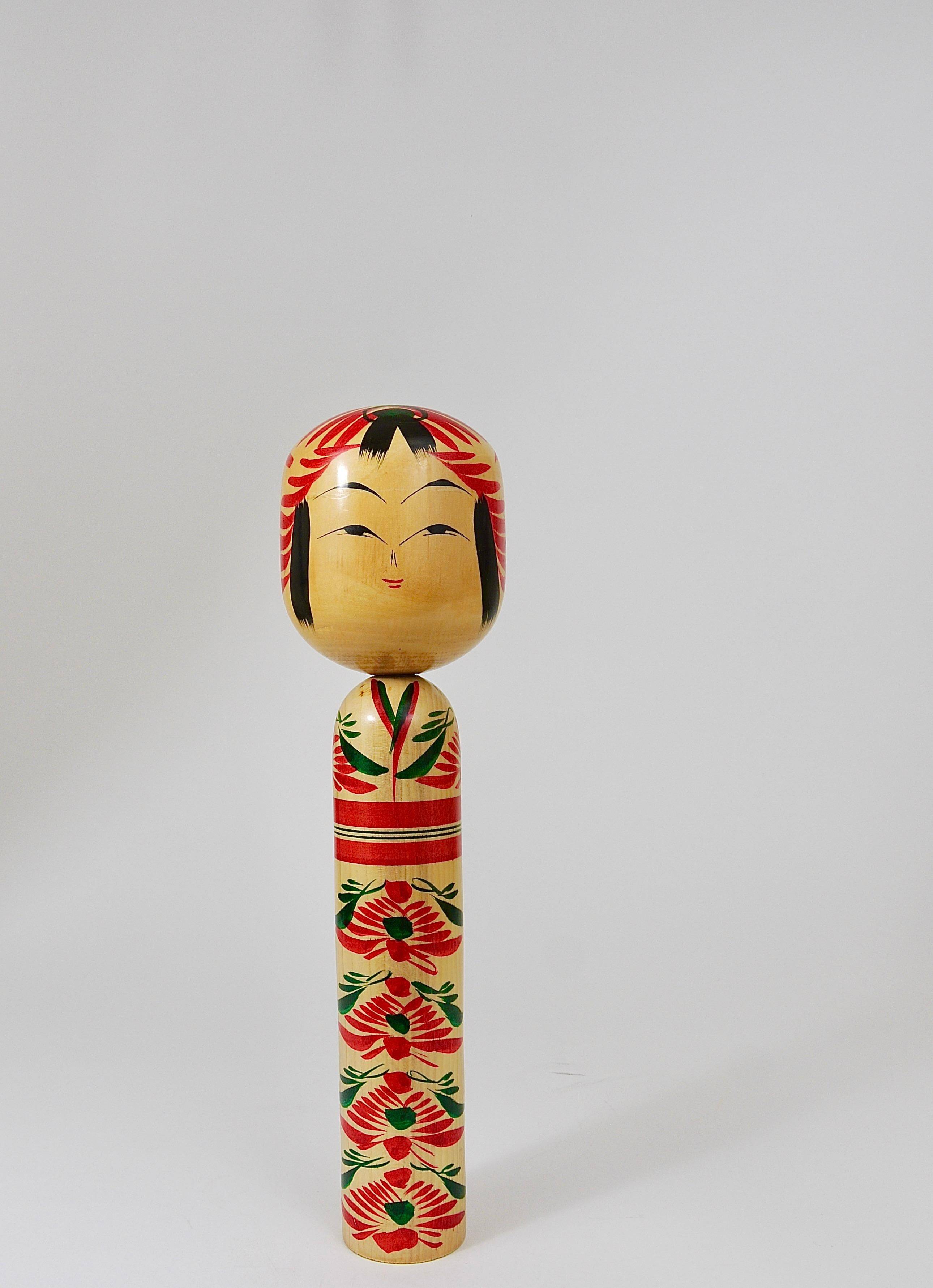 Decorative Kokeshi doll sculpture from northern Japan, hand-painted, signed.