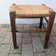 Antique solid wood stool with traditional rush seating – Late 19th century