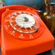 Orange vintage dial phone