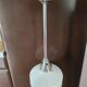 Metal tubular suspension rod and white opal.