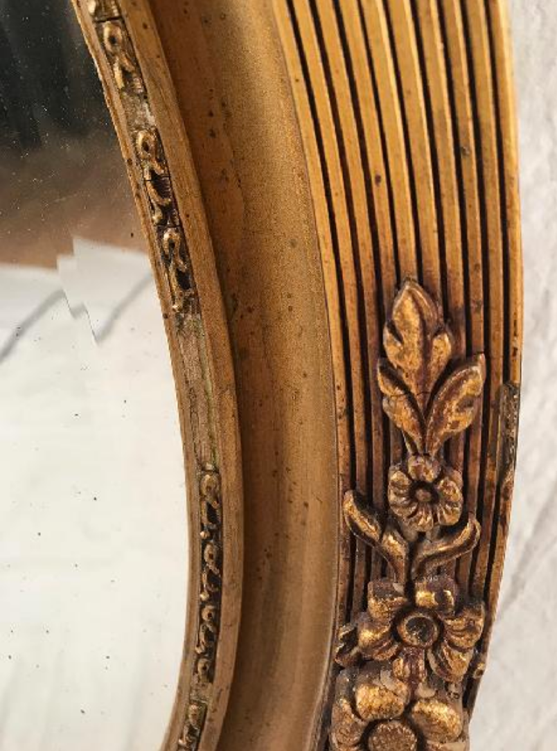 Mirror oval gilded stucco frame