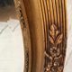 Mirror oval gilded stucco frame