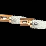 Pair of vintage wall sconces in molded glass and gilded brass