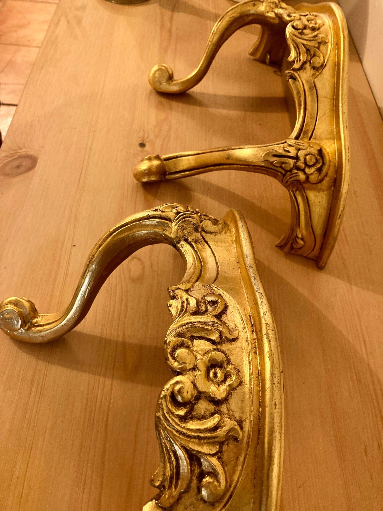Pair of gilded wall shelves