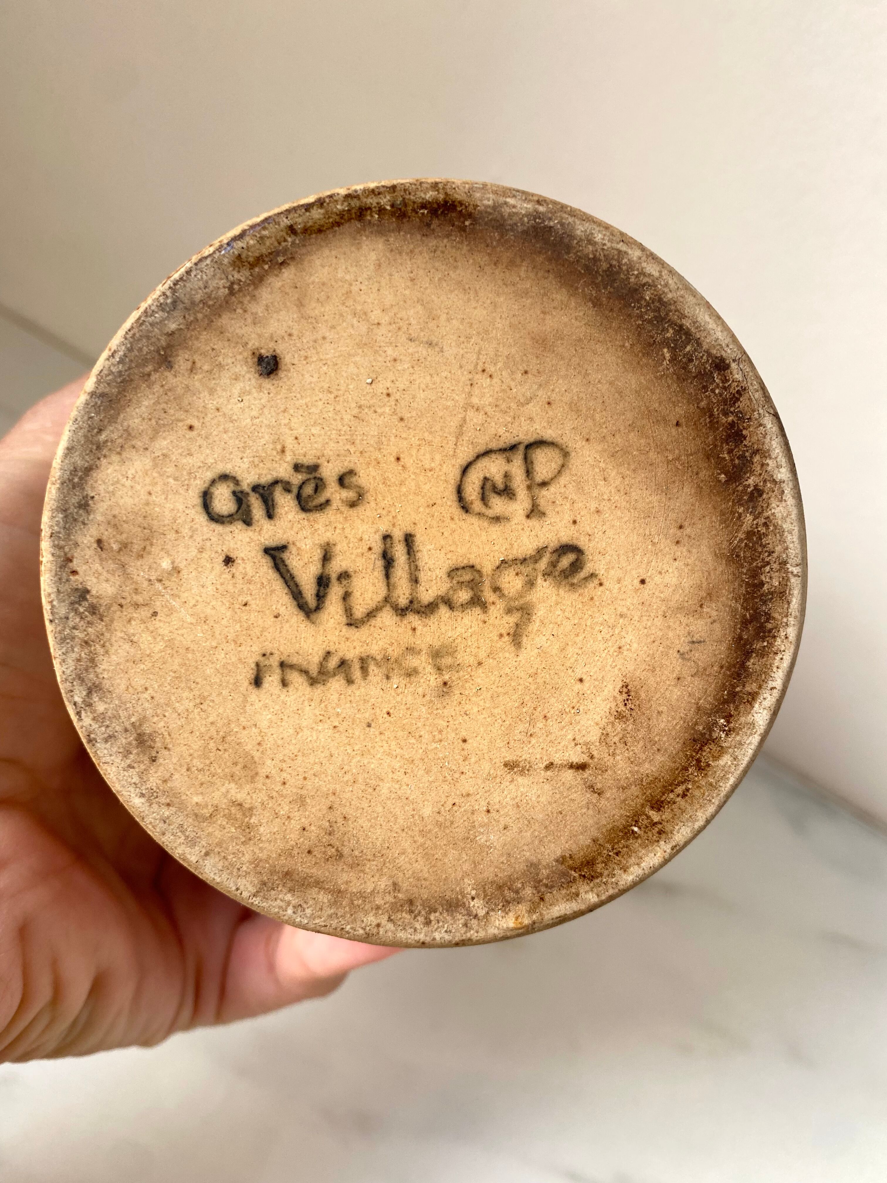 Old vinaigrier in beige sandstone signed Village de France