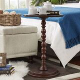Round wooden tables with carving