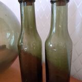 Pair of green bottles made of bubbled blown glass