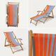 Vintage deck chair with orange and blue striped fabric, original patina.