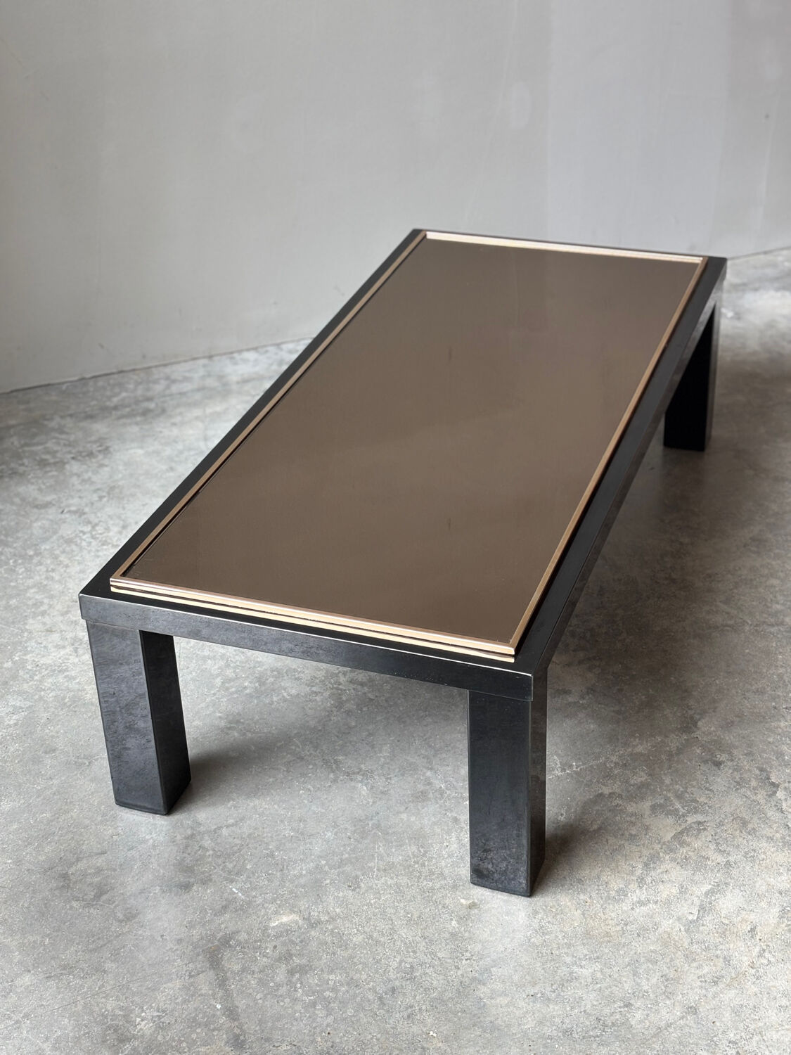 Large Belgochrom coffee table in gold and smoked glass.