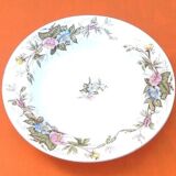 Old hollow dish Polychrome earthenware Floral decoration Diameter: 255mm