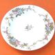 Old hollow dish Polychrome earthenware Floral decoration Diameter: 255mm