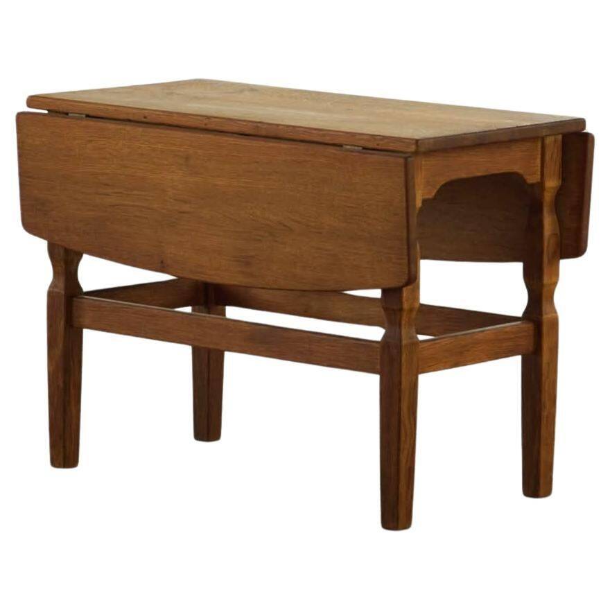 Modern Danish folding side table in solid oak, mid-20th century.