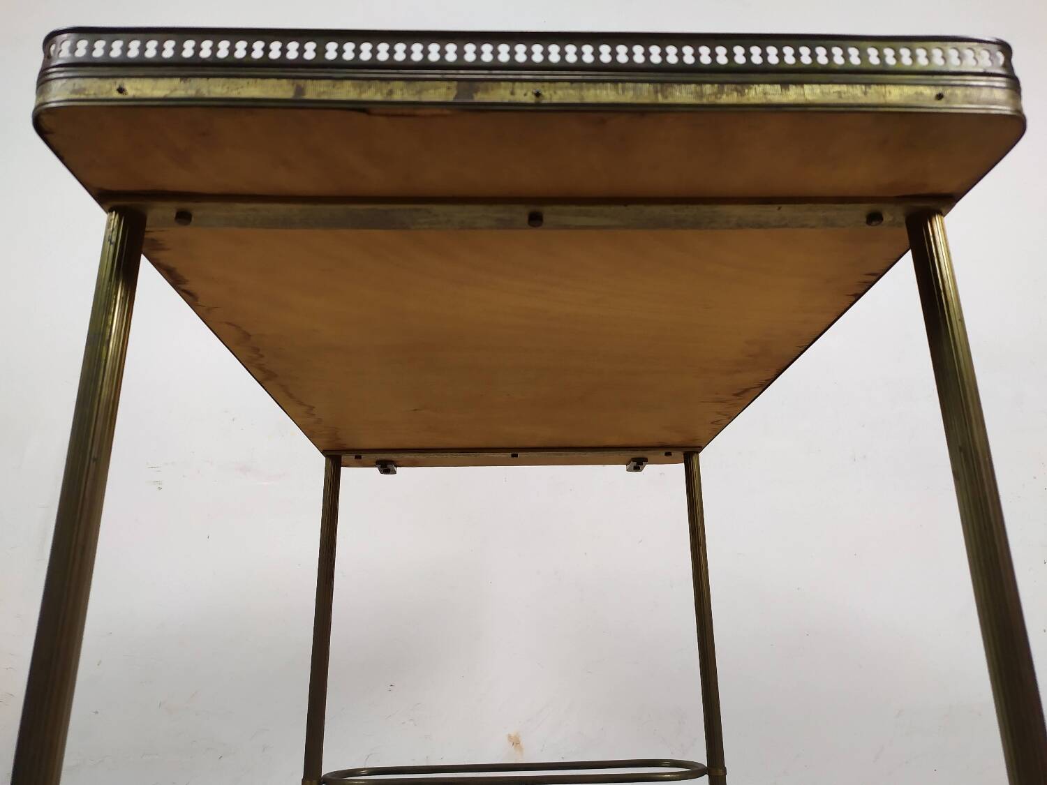 Brass and glass rolling trolley