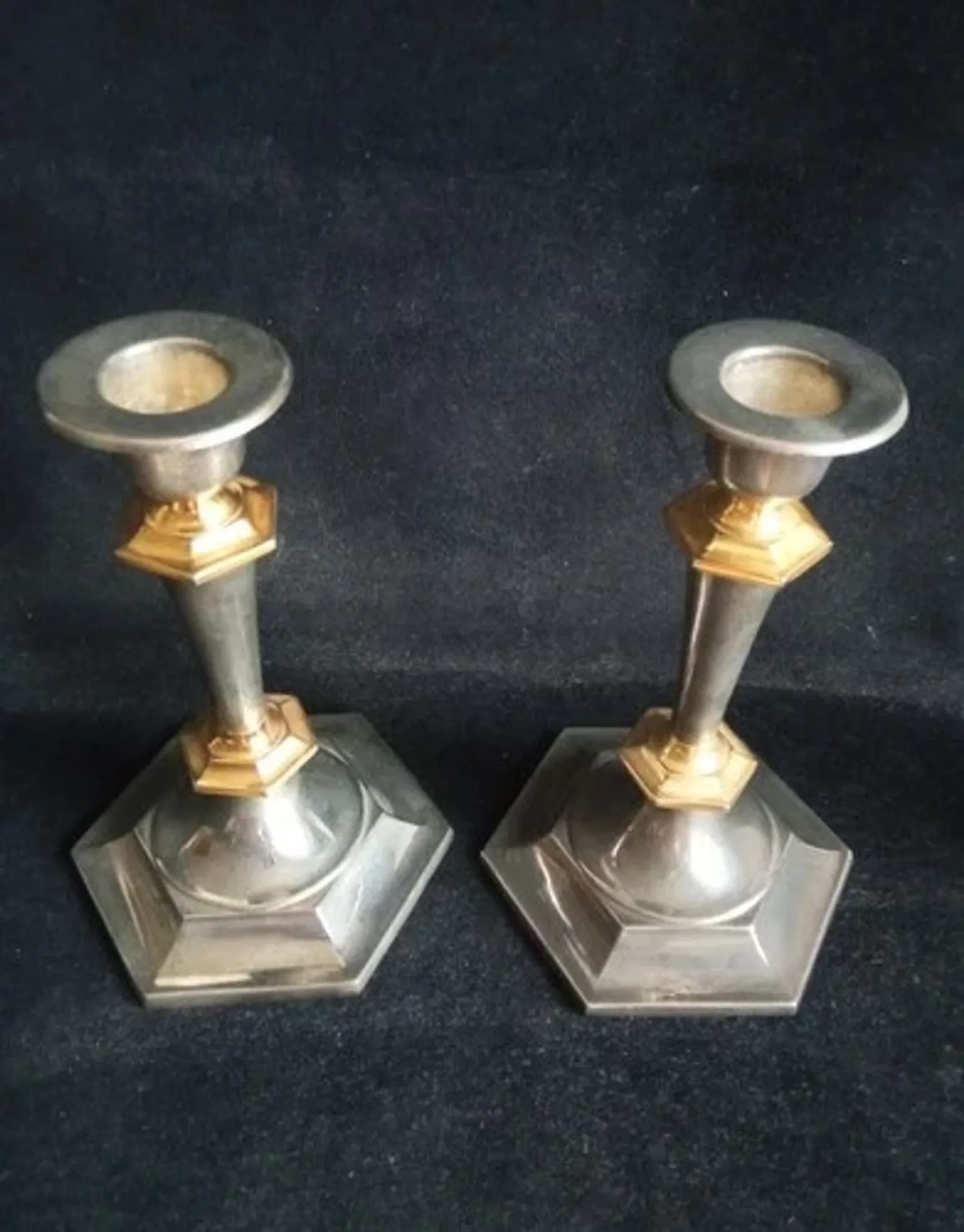 Pair of small English candlesticks in silver-plated metal and brass - 20th century.
