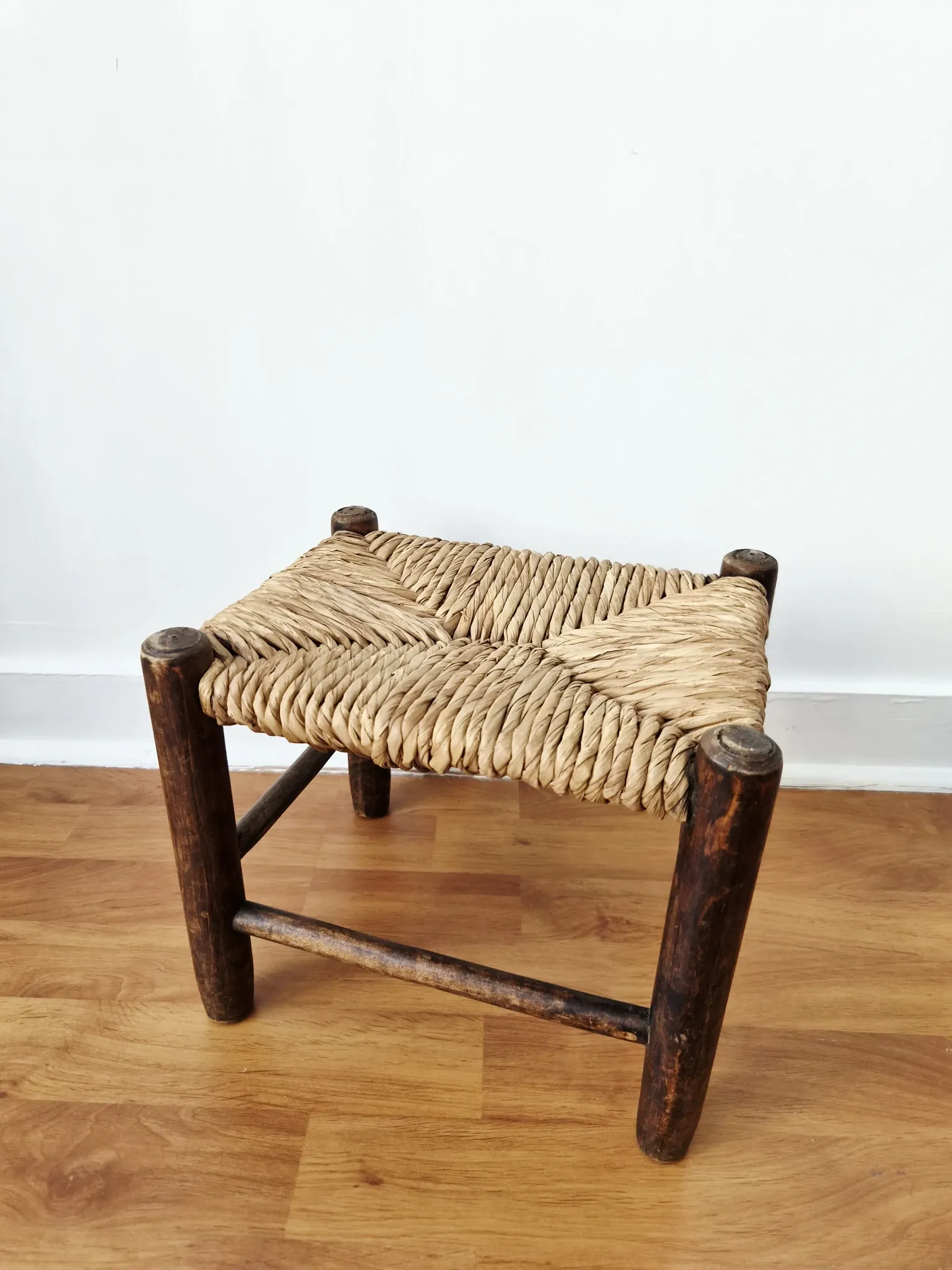 Small rustic vintage wooden and straw stool -