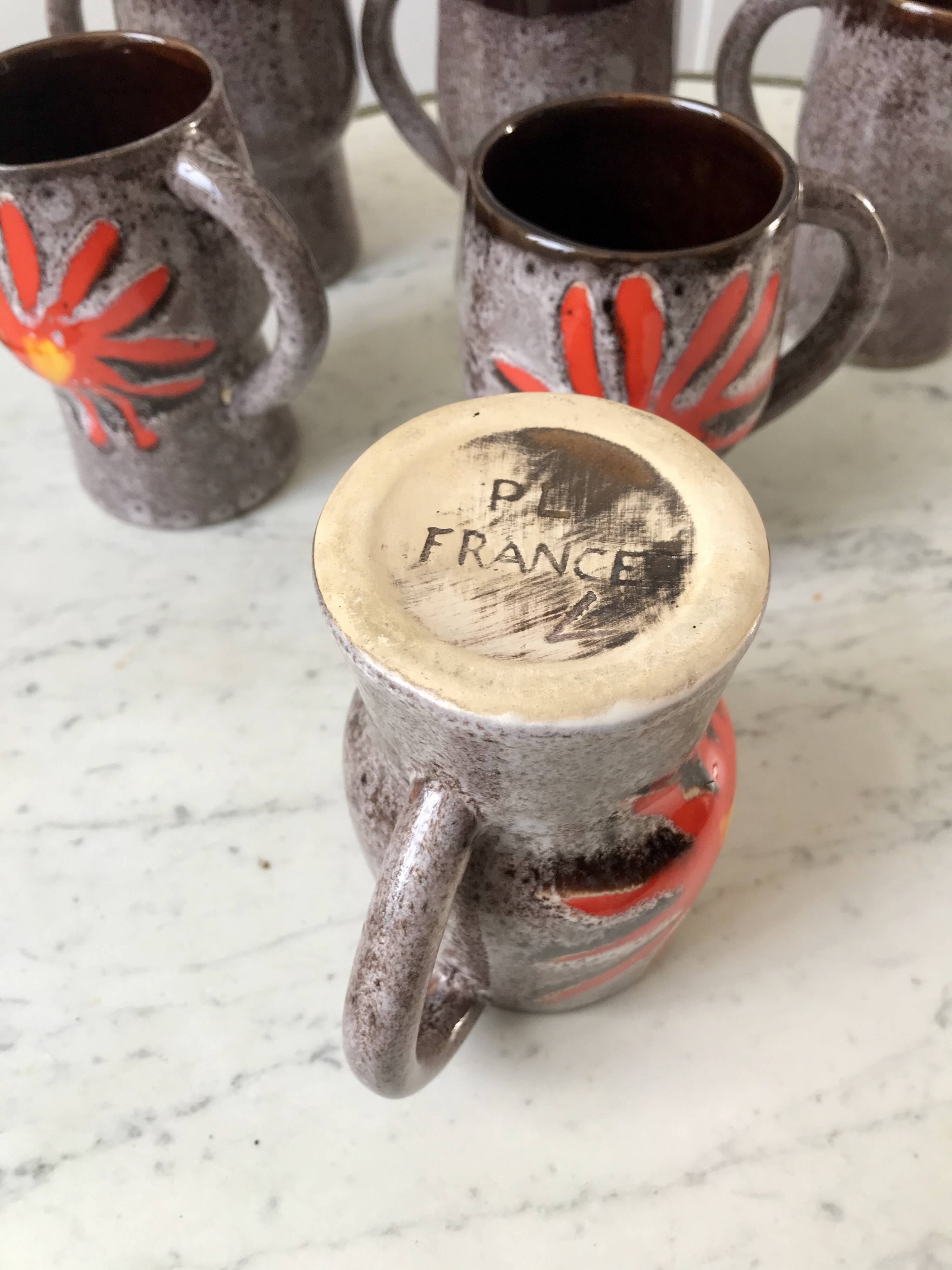 Set of 7 fat lava glazed ceramic mugs signed poët laval 70s